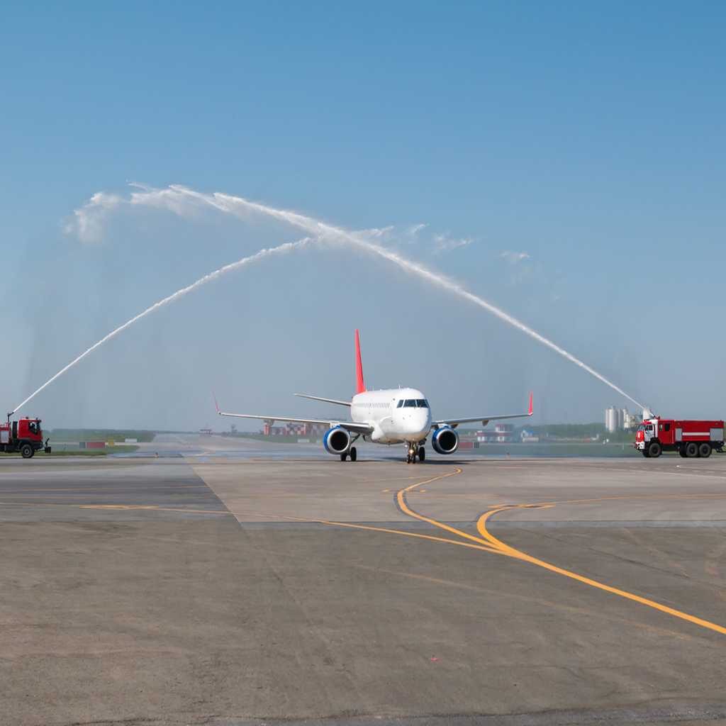 First flight of new airline passes under water salute given by ARFF engines